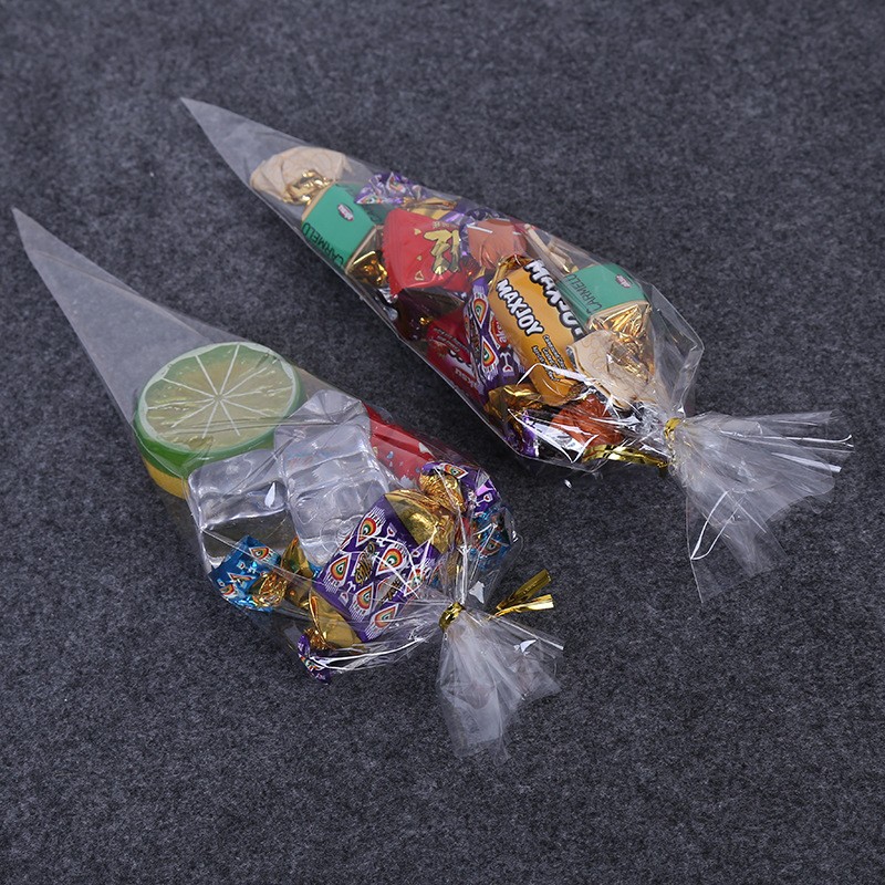 供應(yīng)opp膜塑料袋 創(chuàng)意透明三角袋子糖果食品包裝袋廠家現(xiàn)貨批發(fā)